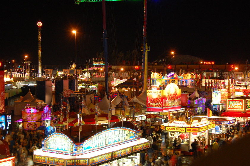 Signs advertising food vendor at the Calgary Stampede.